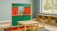 A preschool play area with puppets, table, chairs, and a rug.