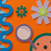 Colorful paper summer decorations including ice cream, flowers, and shapes